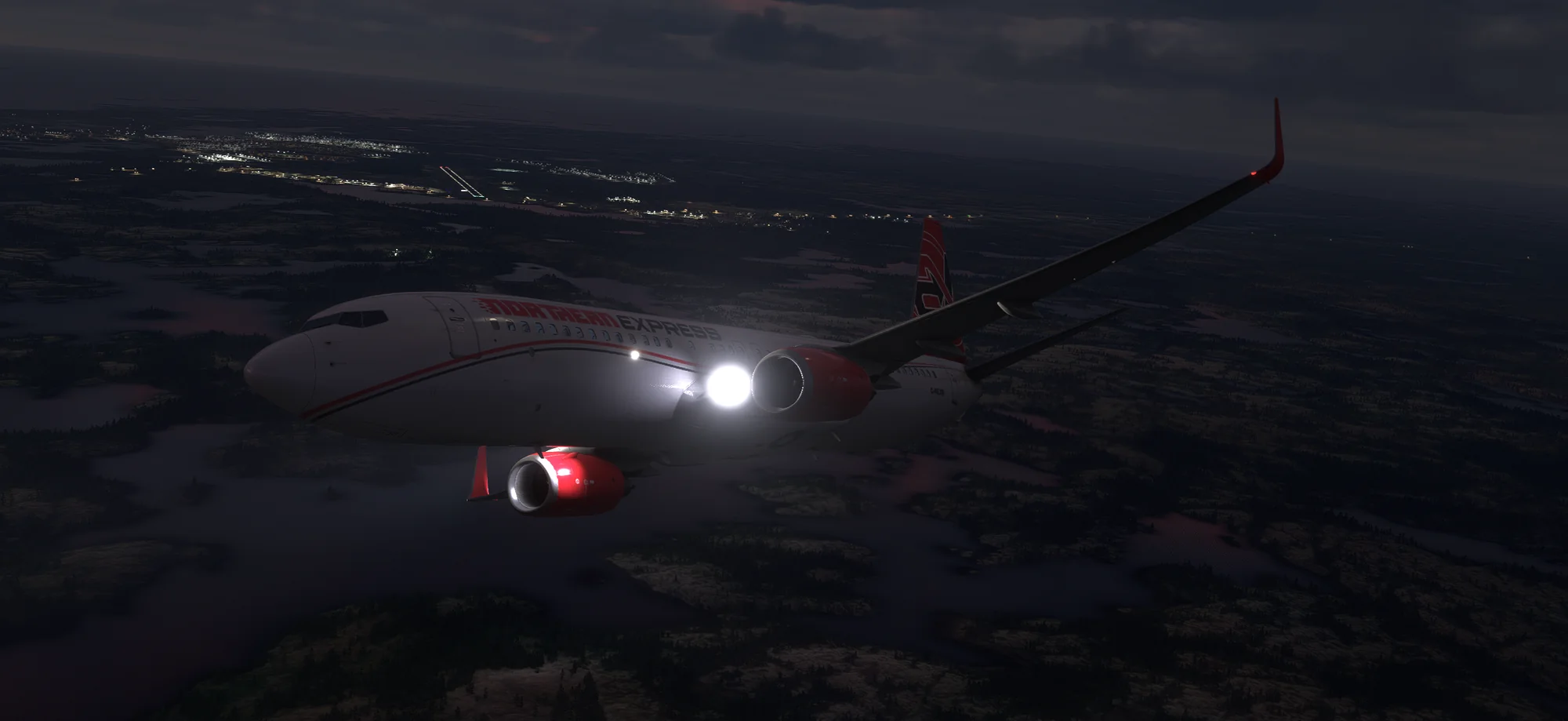 Northern Express Boeing 737-700 flying at night