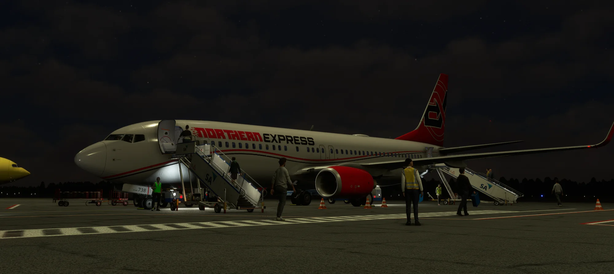Northern Express Boeing 737-800 boarding at night