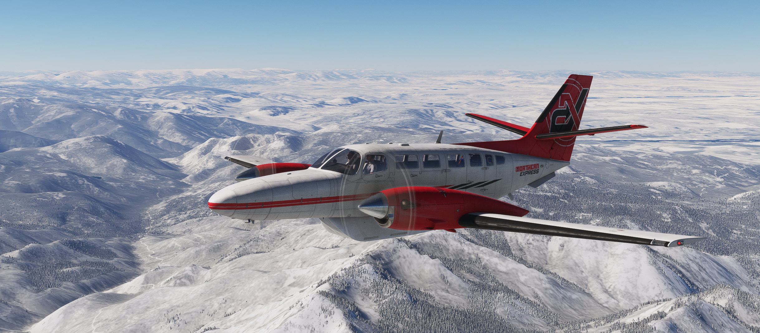 Cessna F406 aircraft flying over snowy mountains