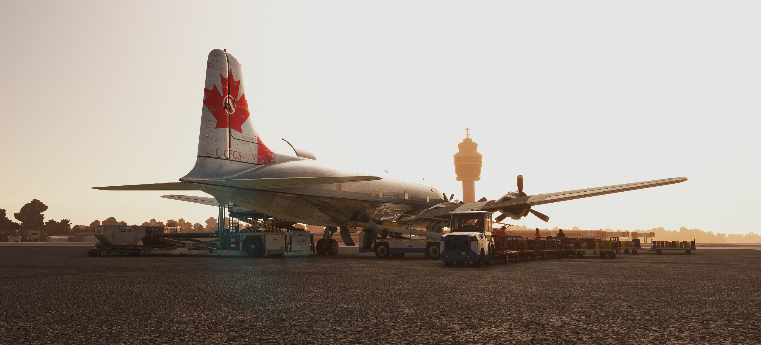 Classic aircraft parked on a ramp at sunset